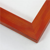 Simple 1-9/16 " molding. This frame has a scarlet red stain over a natural wood finish. The red is laid with a brush stoke effect, leaving the base color and grain visible. It has a smooth, laminate texture.