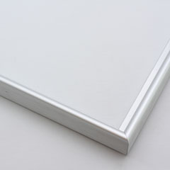 This simple metal picture frame has a smooth, frosted silver finish, brush-textured drop edge and a curved profile.

.375 " width: ideal for small and medium artworks. Easily frame photographs, thicker cloth or needlework art, or even Giclée canvas prints.